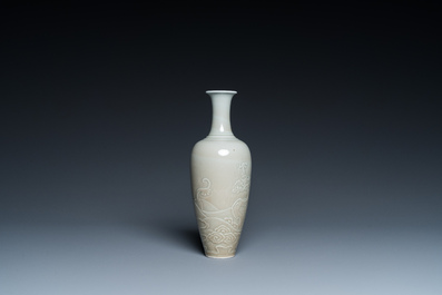 A Chinese celadon-glazed 'sea dragon' vase, Kangxi mark, 19/20th C.