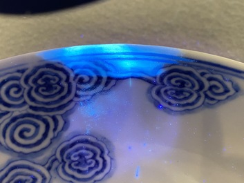 Two Chinese blue and white 'clouds' dishes and three plates, 19th C.