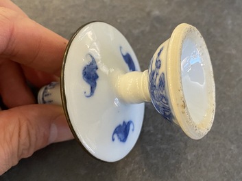 A pair of Chinese blue and white 'Bleu de Hue' candlesticks for the Vietnamese market, Kim Ngoc Cam Kee 金玉錦記 mark, 19th C.