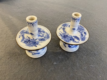 A pair of Chinese blue and white 'Bleu de Hue' candlesticks for the Vietnamese market, Kim Ngoc Cam Kee 金玉錦記 mark, 19th C.