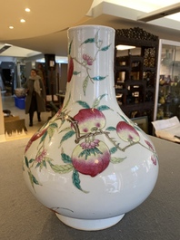 A Chinese famille rose 'nine peaches' bottle vase, 19th C.