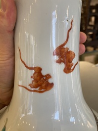 A Chinese famille rose 'nine peaches' bottle vase, 19th C.