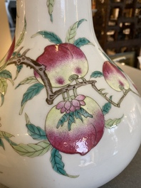 A Chinese famille rose 'nine peaches' bottle vase, 19th C.