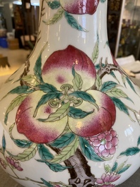 A Chinese famille rose 'nine peaches' bottle vase, 19th C.