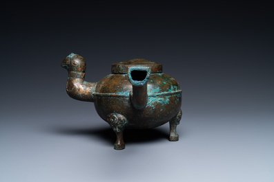 A Chinese gilt bronze tripod 'he' kettle with bird head-shaped spout, Han
