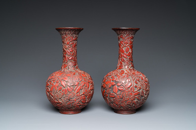 A pair of Chinese red cinnabar lacquer bottle vases, 19/20th C.