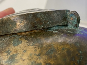 A Chinese gilt bronze tripod 'he' kettle with bird head-shaped spout, Han