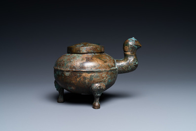 A Chinese gilt bronze tripod 'he' kettle with bird head-shaped spout, Han