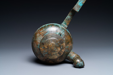 A Chinese gilt bronze tripod 'he' kettle with bird head-shaped spout, Han