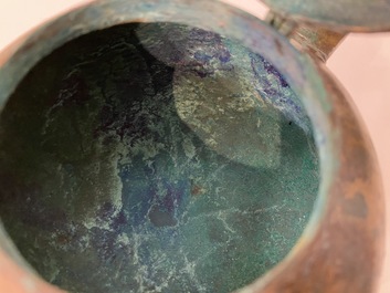 A Chinese gilt bronze tripod 'he' kettle with bird head-shaped spout, Han
