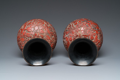 A pair of Chinese red cinnabar lacquer bottle vases, 19/20th C.