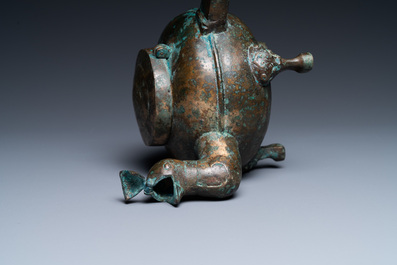 A Chinese gilt bronze tripod 'he' kettle with bird head-shaped spout, Han