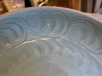 Two Chinese Longquan celadon dishes with underglaze design, Ming