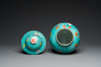 A Chinese turquoise-ground famille rose 'boys at a pomegranate tree' vase and cover, 19th C.