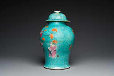 A Chinese turquoise-ground famille rose 'boys at a pomegranate tree' vase and cover, 19th C.