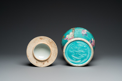 A Chinese turquoise-ground famille rose 'boys at a pomegranate tree' vase and cover, 19th C.