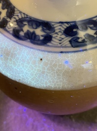 A Chinese blue and white double gourd vase with caf&eacute; au lait-ground base, Kangxi