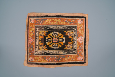 Two Chinese or Tibetan saddleback rugs, 19th C.