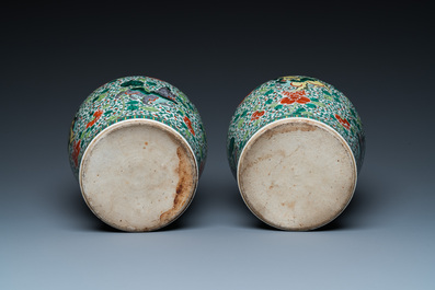A pair of Chinese famille verte 'Buddhist lions' vases, 19th C.