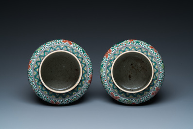 A pair of Chinese famille verte 'Buddhist lions' vases, 19th C.