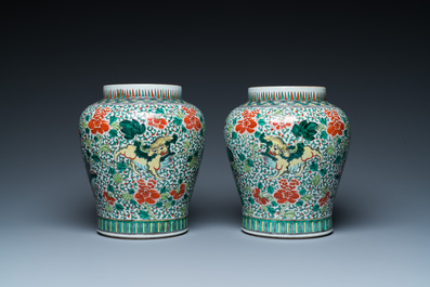 A pair of Chinese famille verte 'Buddhist lions' vases, 19th C.