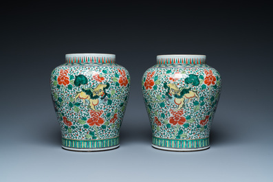 A pair of Chinese famille verte 'Buddhist lions' vases, 19th C.