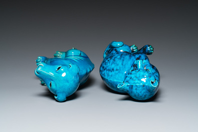 A Chinese turquoise-glazed cat and a dog on wooden stands, 19th C.
