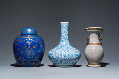 Three Chinese blue and white, crackle-glazed and powder-blue vases, 19th C.