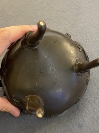 A Chinese bronze tripod censer and cover, 19th C.