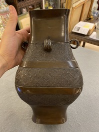 Een Chinese archa&iuml;sche bronzen 'fanghu' vaas, Ming