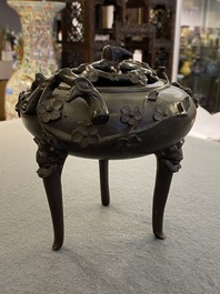 A Chinese bronze tripod censer and cover, 19th C.