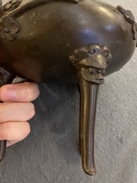 A Chinese bronze tripod censer and cover, 19th C.