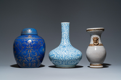 Three Chinese blue and white, crackle-glazed and powder-blue vases, 19th C.