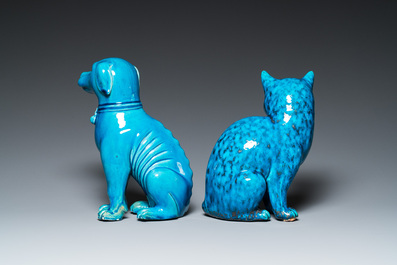 A Chinese turquoise-glazed cat and a dog on wooden stands, 19th C.