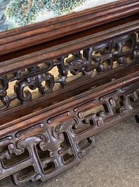 A Chinese famille rose plaque mounted as a table screen, Qianlong