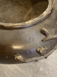 A Chinese bronze tripod censer and cover, 19th C.