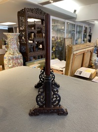 A Chinese famille rose plaque mounted as a table screen, Qianlong