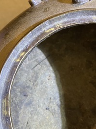 A Chinese bronze tripod censer and cover, 19th C.