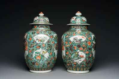 A pair of  Chinese famille verte vases and covers, 19th C.