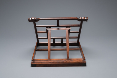 A Chinese foldable huali wooden book stand with brass mounts, Qing