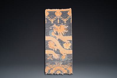 A Chinese silk 'dragons' carpet, 19th C.