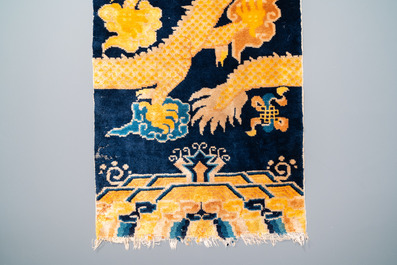 A Chinese silk 'dragons' carpet, 19th C.