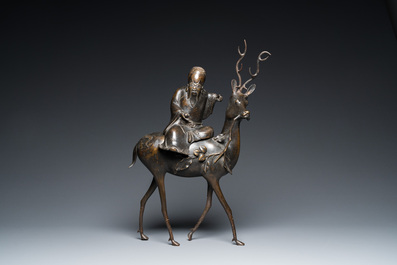 A large Chinese bronze 'Shou Lao on deer' censer, 19th C. or earlier