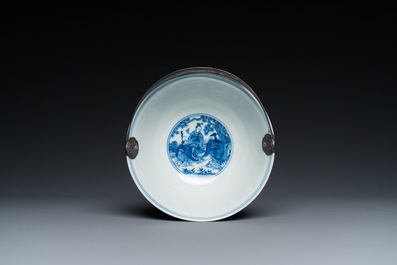 A Chinese blue and white 'eight immortals' bowl with silver handle, Qianlong mark and of the period