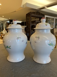 A pair of fine Chinese famille rose vases and covers, 19th C.