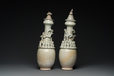 Two large Chinese qingbai-glazed covered urns with applied design, Song/Yuan