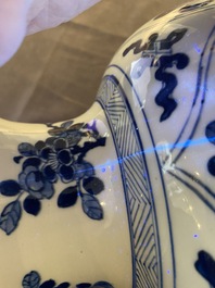 A large Chinese blue and white rouleau vase with floral design, Kangxi