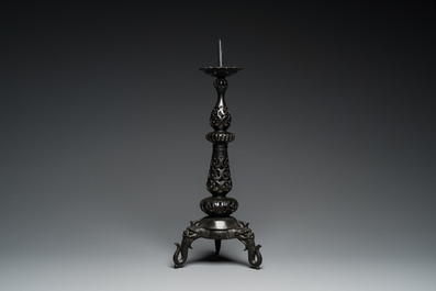 A large Chinese bronze reticulated candle holder, 17th C.