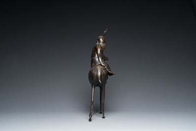 A large Chinese bronze 'Shou Lao on deer' censer, 19th C. or earlier