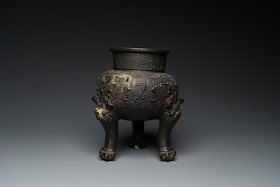 A Chinese bronze tripod 'taotie' censer, Ming